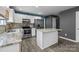 This kitchen has marble countertops, white cabinets, and stainless steel appliances at 4658 Cedar Rock Dr, Charlotte, NC 28273