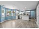 The kitchen features marble countertops, white cabinets, and stainless steel appliances at 4658 Cedar Rock Dr, Charlotte, NC 28273