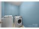 Convenient laundry room with modern washer and dryer units, ample space, and efficient design at 4658 Cedar Rock Dr, Charlotte, NC 28273
