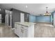 The open concept room features a marble island, hardwood flooring, and modern lighting at 4658 Cedar Rock Dr, Charlotte, NC 28273