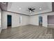 Spacious main bedroom with a tray ceiling, fan, and ensuite bathroom and walk-in closet at 4658 Cedar Rock Dr, Charlotte, NC 28273