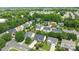 An aerial view shows lush trees surrounding a neighborhood with well-kept lawns at 4658 Cedar Rock Dr, Charlotte, NC 28273