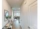 Inviting hallway featuring hardwood floors that lead to a bright and open living space at 5058 Beargrass Dr, Dallas, NC 28034