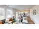 Spacious open-concept space featuring lots of natural light, a view of the backyard and a modern kitchen at 5058 Beargrass Dr, Dallas, NC 28034