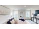 Bright bedroom featuring a large bed, neutral tones, and well-lit windows at 5058 Beargrass Dr, Dallas, NC 28034