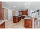 Spacious kitchen with custom cabinetry, granite countertops, stainless steel appliances, and tile flooring at 534 N Ingleside Farm Rd, Iron Station, NC 28080
