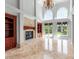 Bright living room with fireplace, built-in bookshelves, soaring ceilings, and French doors at 534 N Ingleside Farm Rd, Iron Station, NC 28080