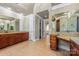 Large main bathroom with dual vanities, granite countertops, and a walk-in shower at 534 N Ingleside Farm Rd, Iron Station, NC 28080
