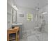 Bright bathroom featuring a glass shower, modern vanity, and stylish gray tile flooring at 5371 Davidson Rd, Davidson, NC 28036