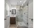 Modern bathroom featuring a glass shower with beautiful tiling and contemporary fixtures, complemented by a vanity at 5371 Davidson Rd, Davidson, NC 28036