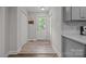 Bright entryway featuring wood-look floors, and modern finishes leads into the main living space at 5371 Davidson Rd, Davidson, NC 28036
