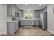 Updated kitchen with gray cabinets, stainless steel appliances, and modern finishes throughout at 5371 Davidson Rd, Davidson, NC 28036