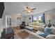 Inviting living room boasts wood-look floors, natural light, and comfortable seating arrangement at 5371 Davidson Rd, Davidson, NC 28036