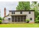 Back exterior of the home, with deck and screened in porch, overlooking a spacious yard at 5604 Bethesda Ct, Charlotte, NC 28226