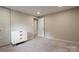 Clean bedroom featuring a large dresser and neutral tones at 5604 Bethesda Ct, Charlotte, NC 28226