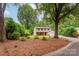 Charming two-story home with a well-manicured front yard, mature trees, and a double garage at 5604 Bethesda Ct, Charlotte, NC 28226