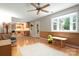 Open Gathering room with hardwood floors, access to the kitchen, and natural light from large windows at 5604 Bethesda Ct, Charlotte, NC 28226
