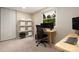 Bright home office featuring a large window with shelving for optimal organization at 5604 Bethesda Ct, Charlotte, NC 28226