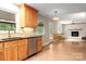Spacious kitchen with wooden cabinets, stainless steel appliances, and adjacent Gathering room at 5604 Bethesda Ct, Charlotte, NC 28226
