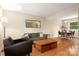 Bright living room featuring hardwood floors, modern furnishings, and ample natural light at 5604 Bethesda Ct, Charlotte, NC 28226