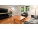 Cozy living room with hardwood floors, natural light, and views of the outdoor landscape at 5604 Bethesda Ct, Charlotte, NC 28226