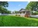 The well-kept lawn features a trampoline, new fencing, and professional landscaping at 6578 Bopre Ln, Denver, NC 28037
