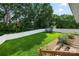 The expansive backyard includes a trampoline, lush lawn, new fencing, and tasteful landscaping at 6578 Bopre Ln, Denver, NC 28037