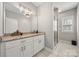 This bathroom has a granite countertop, white cabinets, and a glass shower door at 6578 Bopre Ln, Denver, NC 28037