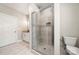 This bathroom has a walk-in shower with tiled walls, floors and a glass door at 6578 Bopre Ln, Denver, NC 28037