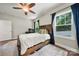 This bedroom has a wooden bed frame and a computer desk with a chair at 6578 Bopre Ln, Denver, NC 28037
