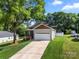 Charming single-Gathering home with a well-maintained lawn and an attached two-car garage at 6578 Bopre Ln, Denver, NC 28037