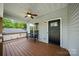 Cozy front porch with a ceiling fan, bench seating, and view of the front yard at 6578 Bopre Ln, Denver, NC 28037