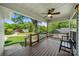 Inviting front porch features wood flooring, railings, a bench, and a view of the neighborhood at 6578 Bopre Ln, Denver, NC 28037
