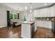 Kitchen island with granite countertops, stainless steel appliances, and a dining area at 6578 Bopre Ln, Denver, NC 28037