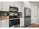 Well-equipped kitchen with stainless steel appliances and ample counter space at 6578 Bopre Ln, Denver, NC 28037