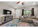 Cozy living room with a large sofa, area rug, and a view of the outdoors at 6578 Bopre Ln, Denver, NC 28037