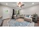 Comfortable living room with a large sectional sofa, area rug, and ample natural light at 6578 Bopre Ln, Denver, NC 28037