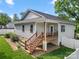Exterior view of rear deck, yard with new fence, and well-maintained landscaping at 6578 Bopre Ln, Denver, NC 28037