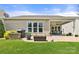 Picture of the backyard featuring a patio, a barbecue, and well-manicured lawn at 7036 Kitty Hawk Ln, Fort Mill, SC 29707