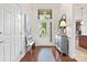 Inviting foyer with a large glass door, hardwood floors, and stylish decor, perfect for welcoming guests at 7036 Kitty Hawk Ln, Fort Mill, SC 29707