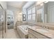 Primary bath featuring a soaking tub, double sinks, granite counters and tiled floors and shower at 7428 Edenbridge Ln, Charlotte, NC 28226