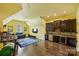 Bonus room with media area, wet bar, and exercise equipment offers the perfect space for recreation at 7428 Edenbridge Ln, Charlotte, NC 28226