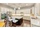 Spacious kitchen with granite countertops, stainless steel appliances, and a dark wood kitchen island at 7428 Edenbridge Ln, Charlotte, NC 28226