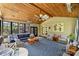 Inviting sunroom with wood ceiling, ceiling fan, and access to the outdoors at 7428 Edenbridge Ln, Charlotte, NC 28226