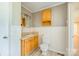 Charming bathroom with oak vanity, wood plank flooring, and beadboard walls at 8282 Park Edwards Rd, Kannapolis, NC 28081