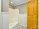 Cozy bathroom featuring a standing shower and wood cabinet at 8282 Park Edwards Rd, Kannapolis, NC 28081