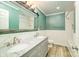 Stylish bathroom features a double vanity, herringbone tile, and modern fixtures at 8282 Park Edwards Rd, Kannapolis, NC 28081