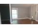 A bedroom with hardwood floors, natural light and a door with a pet door at 8282 Park Edwards Rd, Kannapolis, NC 28081