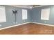 Bright and airy bedroom with hardwood floors, fresh paint, ceiling fan, and natural lighting at 8282 Park Edwards Rd, Kannapolis, NC 28081