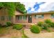 Beautiful brick home featuring a landscaped front yard, welcoming porch, and charming exterior details at 8282 Park Edwards Rd, Kannapolis, NC 28081